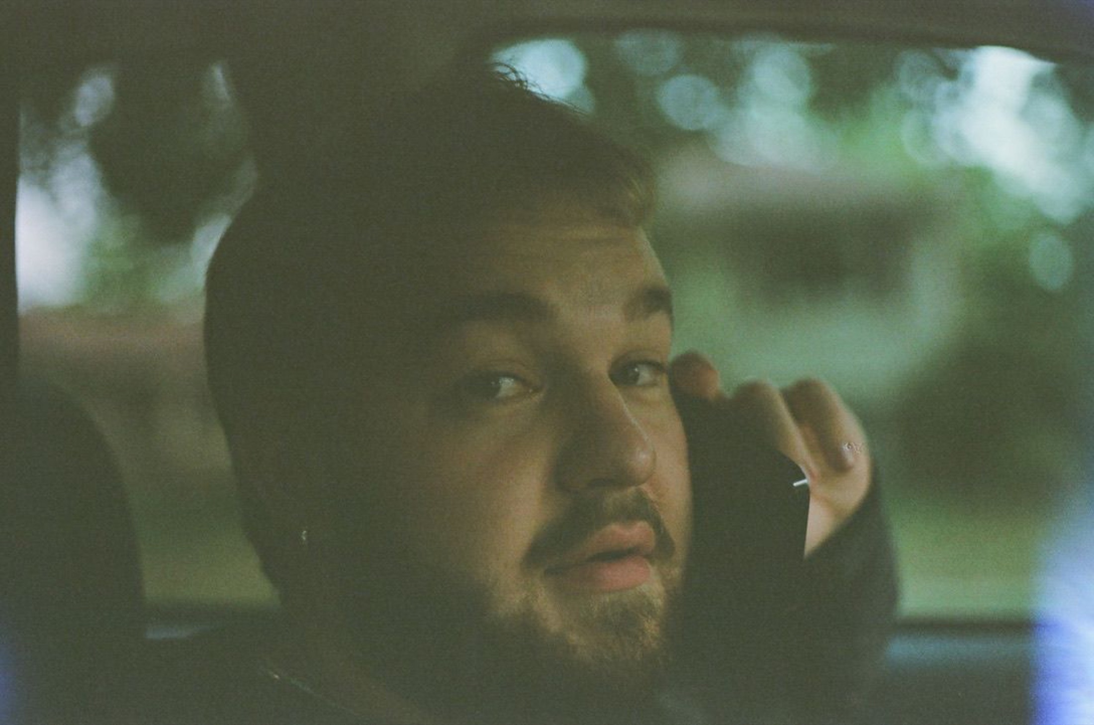 Candid portrait of Tyler Schwenk in a car